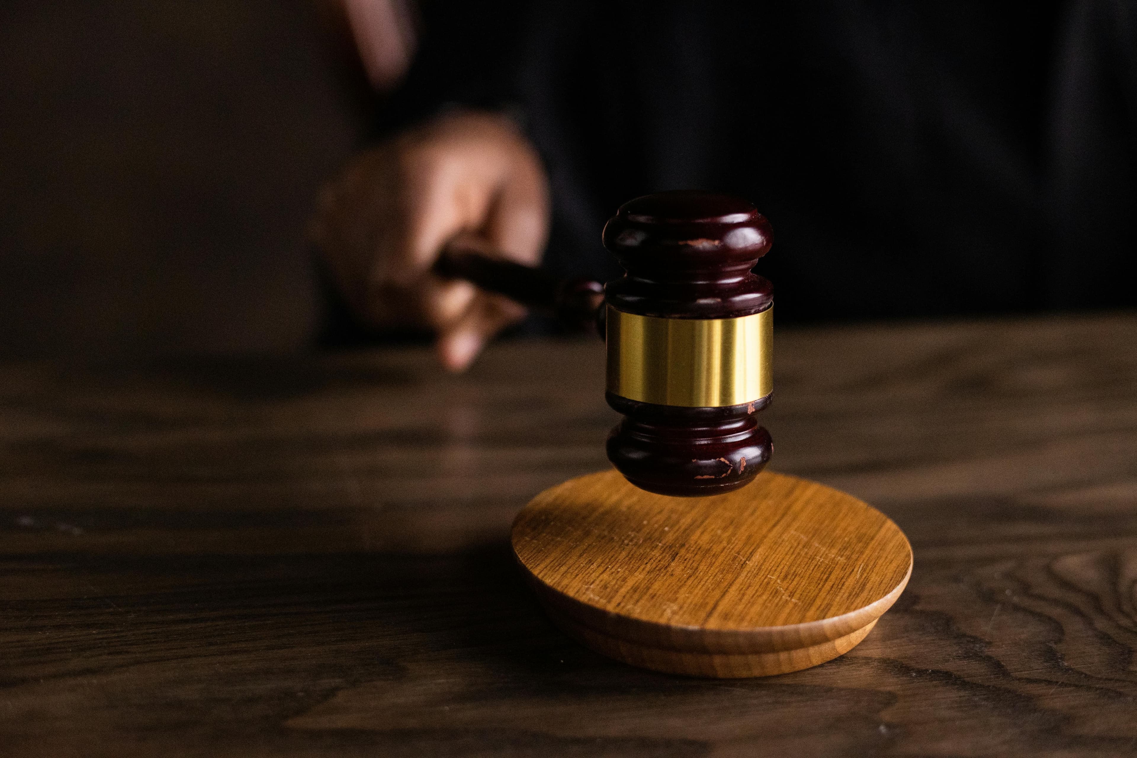 A black gavel on a desk